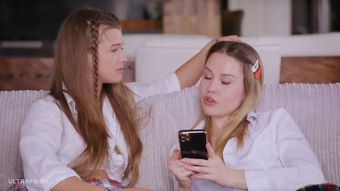 Two College Girls Erika Eden and Olivia Sparkle Making Out on the Couch